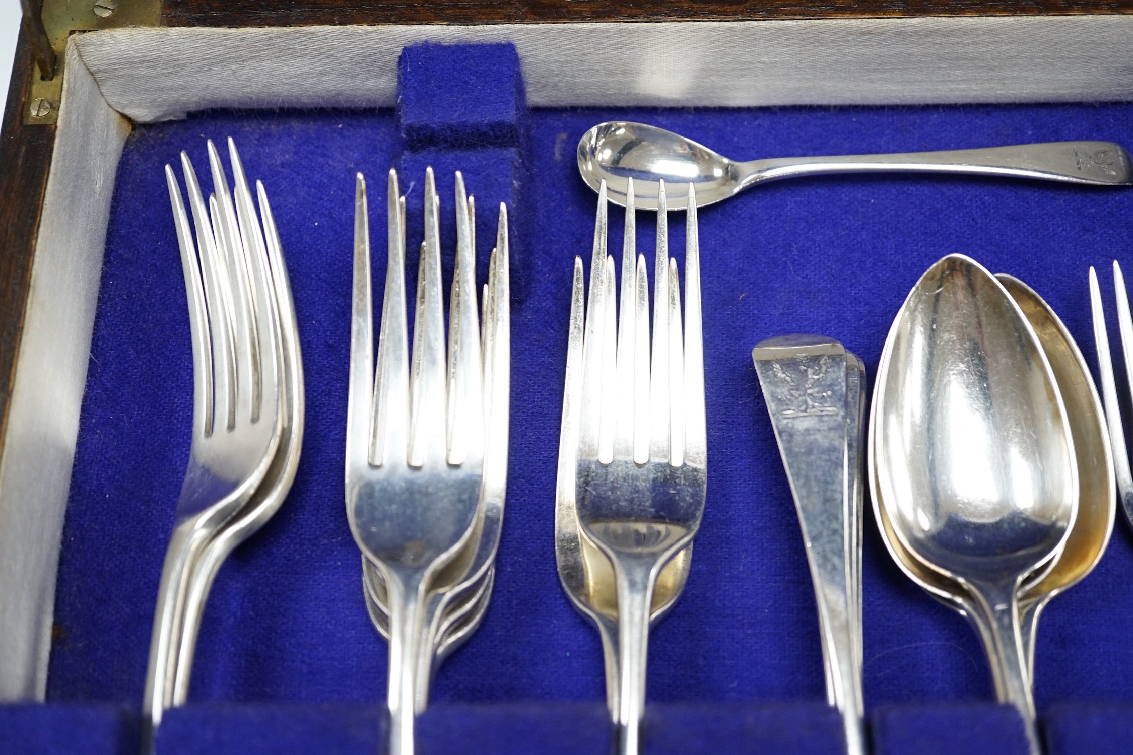 A part canteen of 19th century silver flatware, various dates, patterns and makers, including a set of eight George III silver dessert forks, Thomas Wallis II, London, 1806 and a set of eight dessert spoons, Richard Cros